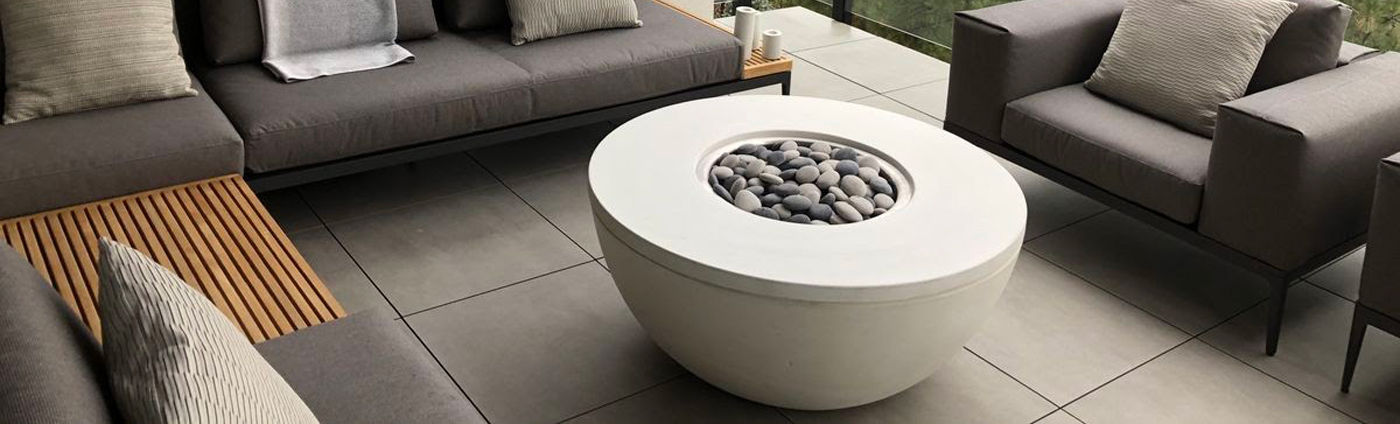 One of Versatile Concrete’s specialties are concrete firebowls, like this precast concrete firebowl that is the centrepiece of this intimate outdoor space. 